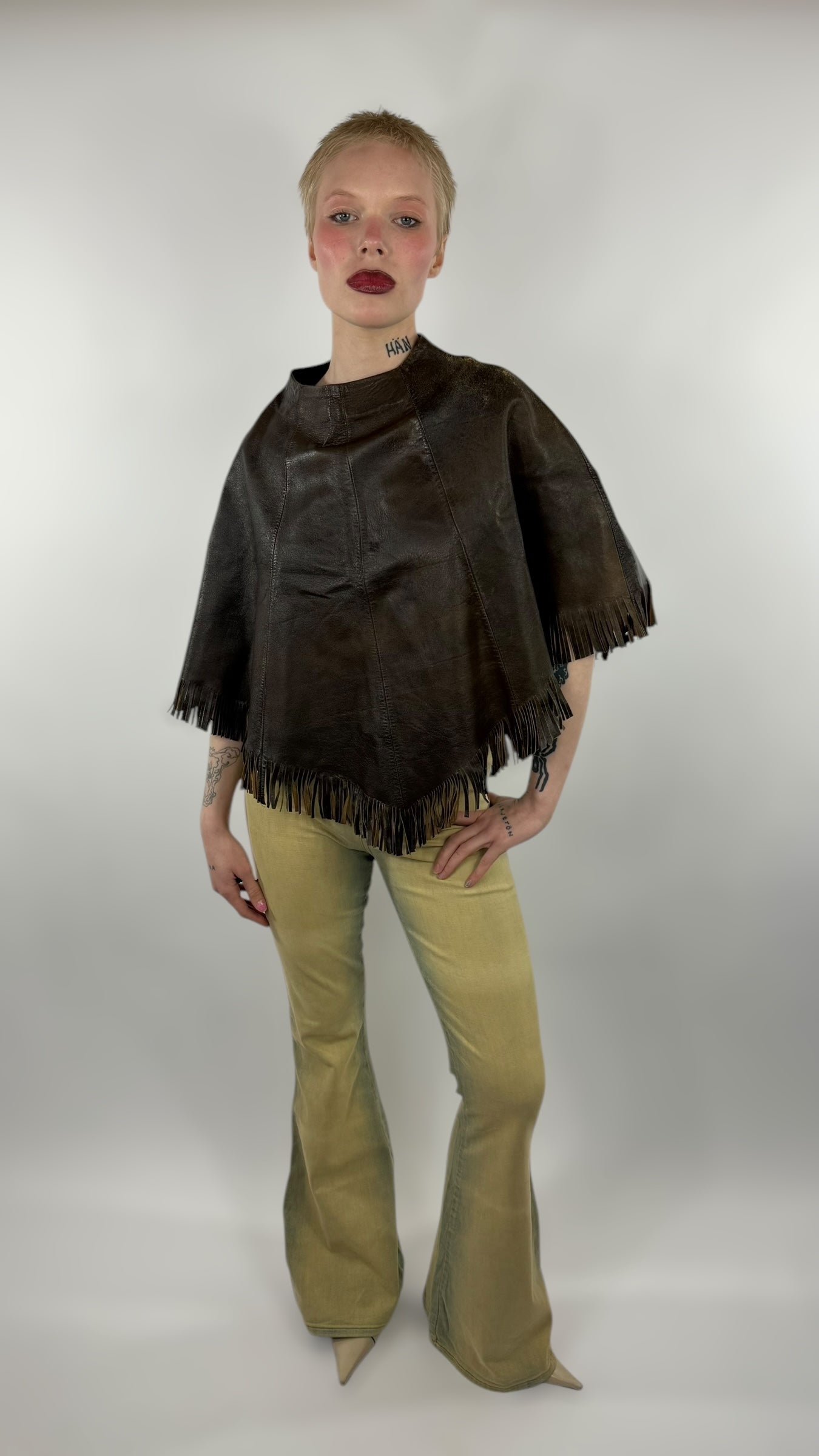 Poncho en cuir à franges